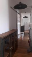 a room with a wooden desk in a room at Appartement vue sur l ocean in Hendaye
