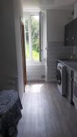 a kitchen with a washing machine and a window at Appartement vue sur l ocean in Hendaye