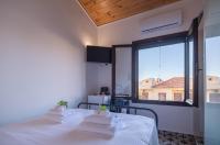 Posteľ alebo postele v izbe v ubytovaní Marthas DeLight Rooms