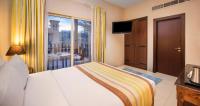 Postel nebo postele na pokoji v ubytování Al Hamra Village Hotel