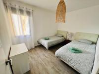 Posteľ alebo postele v izbe v ubytovaní Modern apartment with sea views in Corralejo