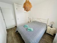 Posteľ alebo postele v izbe v ubytovaní Modern apartment with sea views in Corralejo