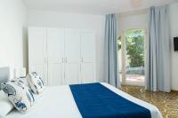 A bed or beds in a room at Villa Trani