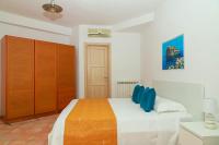 A bed or beds in a room at Villa Trani