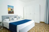 A bed or beds in a room at Villa Trani