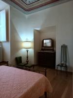 Łóżko lub łóżka w pokoju w obiekcie Palazzo Bianchi Bandinelli by FrancigenaApartments