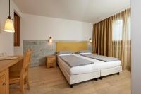 Posteľ alebo postele v izbe v ubytovaní Hotel Rezia