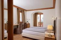 Posteľ alebo postele v izbe v ubytovaní Hotel Rezia