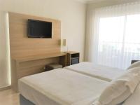 Postel nebo postele na pokoji v ubytování Hotel Las Vegas