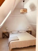 Posteľ alebo postele v izbe v ubytovaní Chalet en Normandie au coeur du pays d'Auge