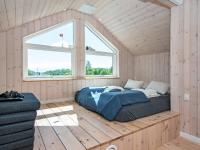Postel nebo postele na pokoji v ubytování Holiday Home Pøt Strandby IX