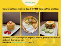 a collage of four pictures of food on a plate at Wonderloft Hostel Kota Tua in Jakarta