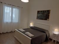 A bed or beds in a room at Villa Punta Piccola sul mare