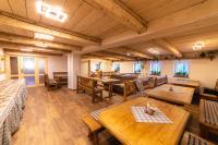 a large room with wooden tables and chairs at Apartmány Penzion Koula in Pec pod Sněžkou
