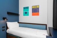 A bed or beds in a room at CX Turin Vanchiglia