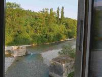 a view of a river from a train window at -Moulin de Solaure- in Pont-de-Quart