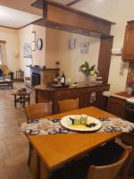 a kitchen with a table with a plate of food on it at Adorable 2 floors two bedroom vacation maisonette in Nea Potidaea