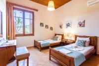Postel nebo postele na pokoji v ubytování Olive Villas