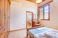 Postel nebo postele na pokoji v ubytování Olive Villas