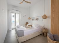 Posteľ alebo postele v izbe v ubytovaní Elyos Apartments
