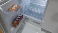an open refrigerator with drinks and snacks in it at Apartman 222 in Brčko