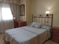 Posteľ alebo postele v izbe v ubytovaní Hotel Beatriz