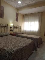 Posteľ alebo postele v izbe v ubytovaní Hotel Beatriz
