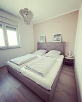 Postel nebo postele na pokoji v ubytování Apartment Mala Medulin