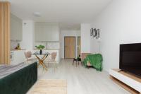 Televízia a/alebo spoločenská miestnosť v ubytovaní Cozy Studio Żupnicza Soho Factory by Noclegi Renters