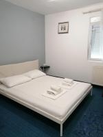 Posteľ alebo postele v izbe v ubytovaní Hotel Garny Pleso