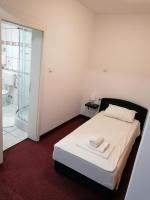 Posteľ alebo postele v izbe v ubytovaní Hotel Garny Pleso