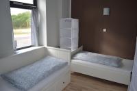 Postel nebo postele na pokoji v ubytování Wassersportzentrum Alte Feuerwache