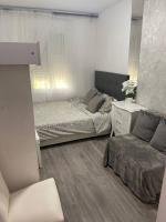 Łóżko lub łóżka w pokoju w obiekcie LUXURY room en MADRID