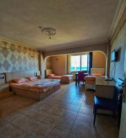 A bed or beds in a room at KILIÇ MOTEL
