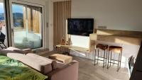 TV a/nebo společenská místnost v ubytování Apartment No. 29 - Riviéra Lipno nad Vltavou 511