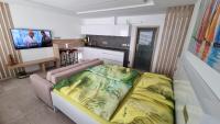 TV a/nebo společenská místnost v ubytování Apartment No. 29 - Riviéra Lipno nad Vltavou 511