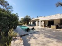 two black bears are standing next to a swimming pool at La Villa Kallisté in Vacquières