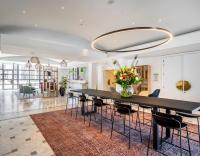 a dining room with a large black table and chairs at Holiday Inn Hasselt by IHG in Hasselt