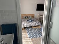 A bed or beds in a room at Alzira bonita Ático E Plaza Mayor con gran terraza