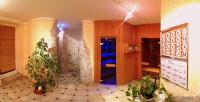 a room with some plants in a room with a shower at Pension Weinberger in Obertauern