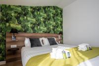 ATHOME RESIDENCE ET SPAにあるベッド