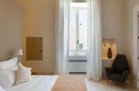 Posteľ alebo postele v izbe v ubytovaní Palazzo Tafuri Boutique Hotel