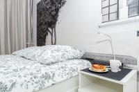 Posteľ alebo postele v izbe v ubytovaní Landmark Apartments