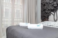 Posteľ alebo postele v izbe v ubytovaní Landmark Apartments