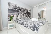 Posteľ alebo postele v izbe v ubytovaní Landmark Apartments