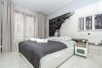 Posteľ alebo postele v izbe v ubytovaní Landmark Apartments