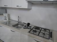 Kuchyňa alebo kuchynka v ubytovaní Apartman Vale