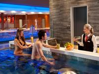a group of people in a swimming pool at Hotel Vitality in Vendryně