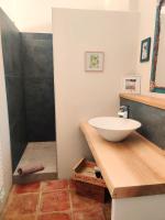 a bathroom with a sink and a shower at chambre d&#39;hôtes Et Puis Voilà! in Murs