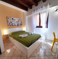 A bed or beds in a room at I Vicini del Re Holiday Home
